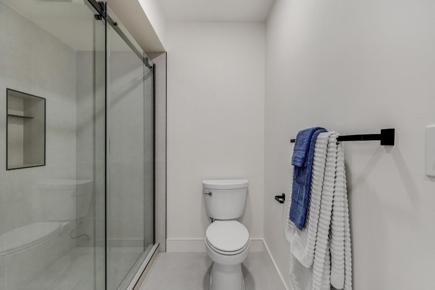 333 Santana Row, Unit 224 San Jose, CA 95128 - Photo 21 of 30 a bathroom with a toilet and a shower