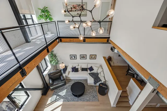 a view of living room with furniture and wooden floor