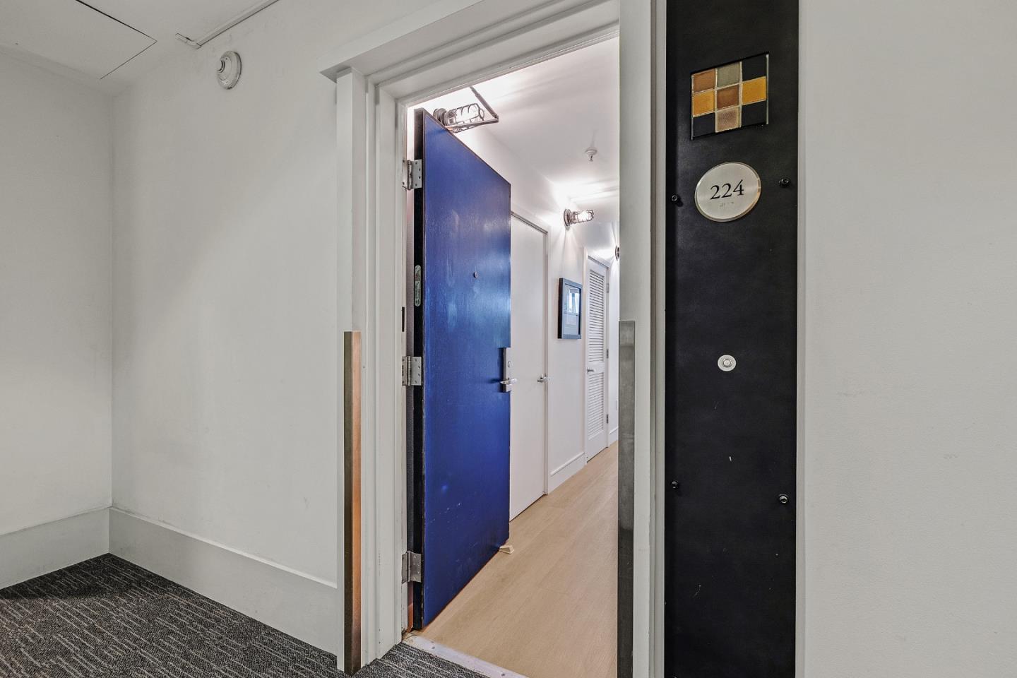 333 Santana Row, Unit 224 San Jose, CA 95128 - Photo 3 of 30 a view of a hallway with wooden floor