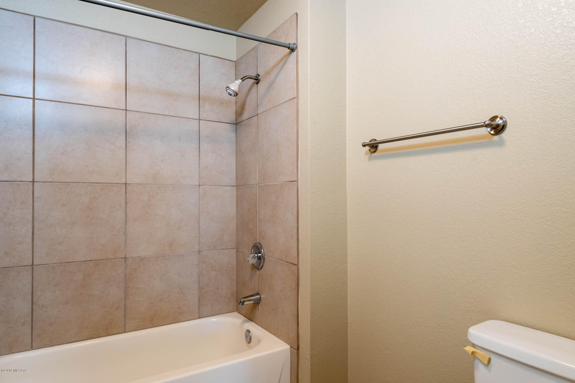 7255 East Snyder Road, Unit 8205 Tucson, AZ 85750 - Photo 10 of 23 a bathroom with a shower and a bath tub