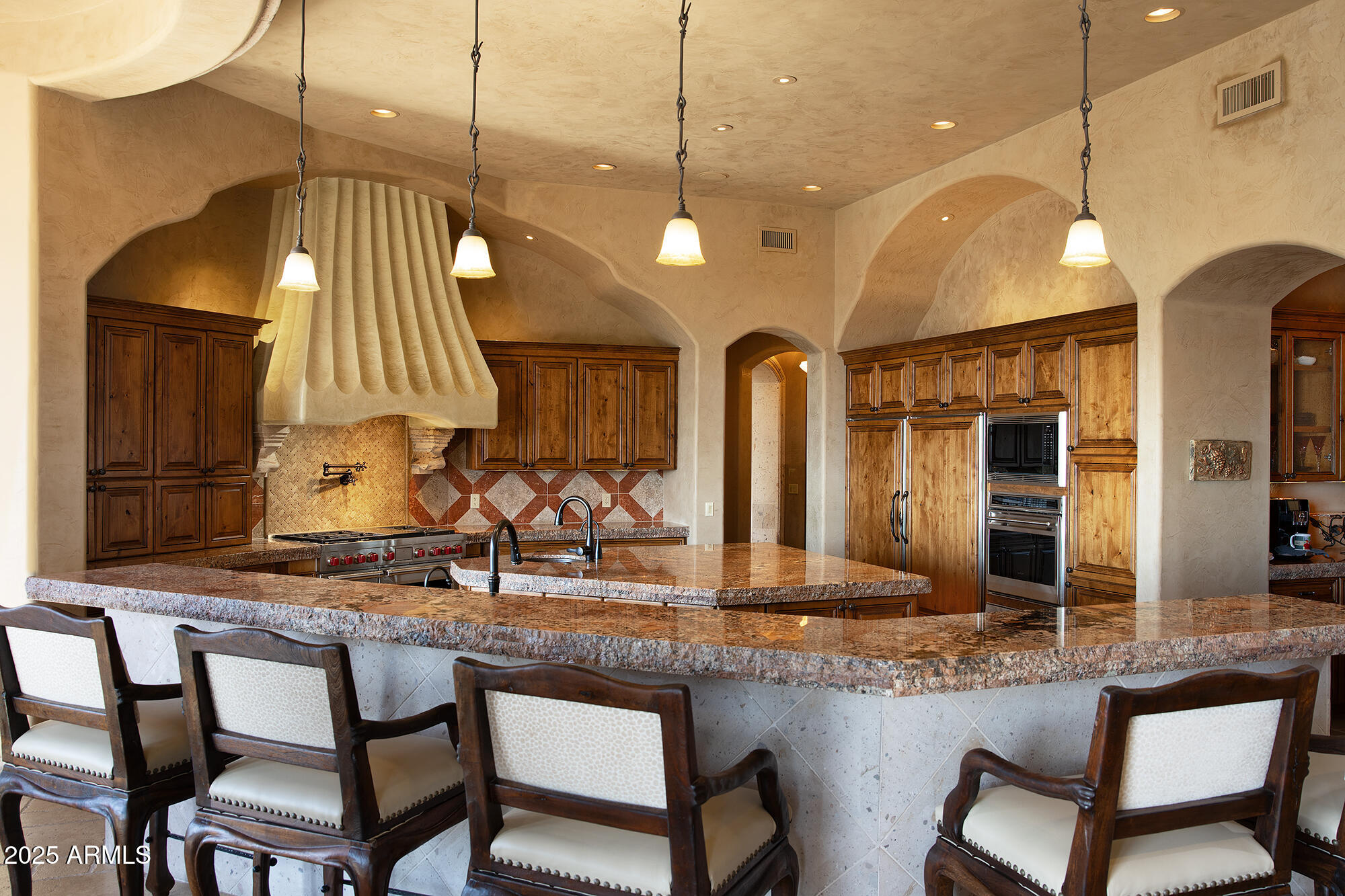 10801 East Happy Valley Road, Unit 119 Scottsdale, AZ 85255 - Photo 11 of 52 a kitchen with a sink and chairs