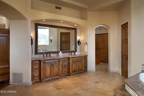 a view of a bathroom with dual sinks