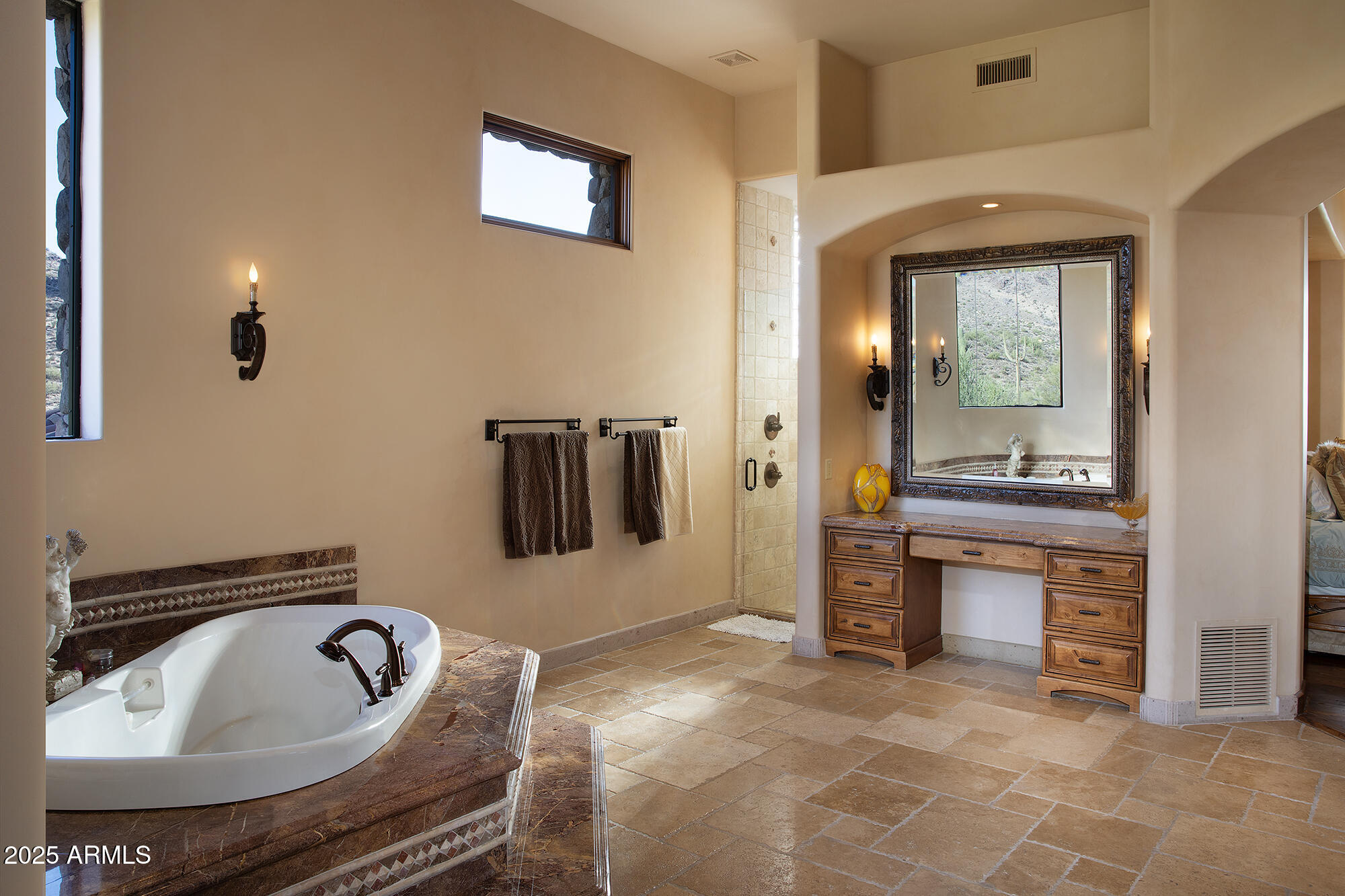 10801 East Happy Valley Road, Unit 119 Scottsdale, AZ 85255 - Photo 23 of 52 a spacious bathroom with a granite countertop tub sink and mirror