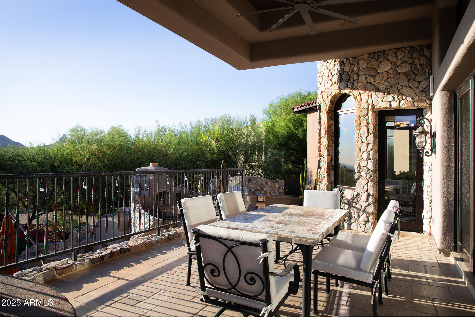 10801 East Happy Valley Road, Unit 119 Scottsdale, AZ 85255 - Photo 27 of 52 a view of a patio with a table chairs and a backyard