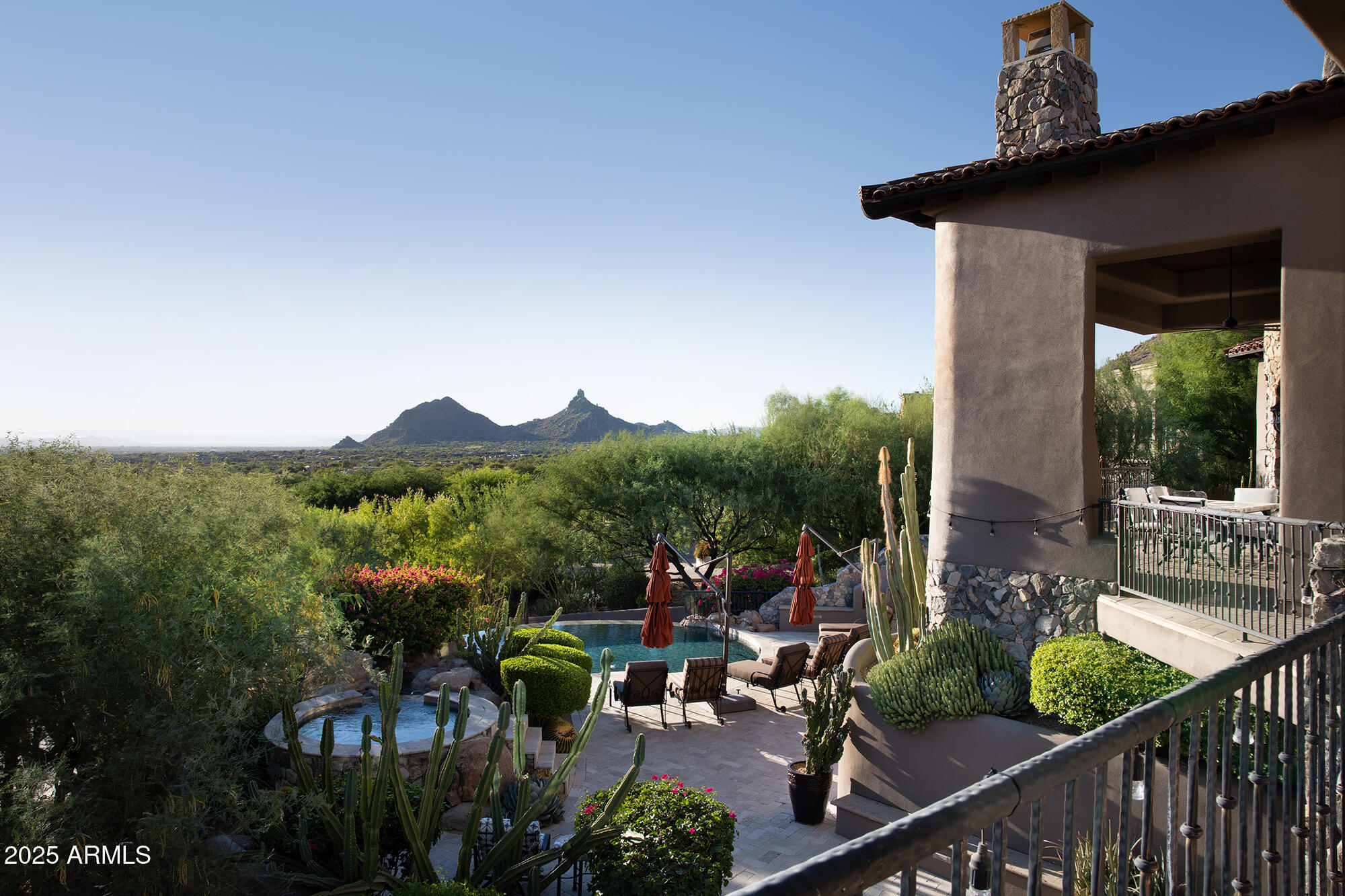 10801 East Happy Valley Road, Unit 119 Scottsdale, AZ 85255 - Photo 31 of 52 a view of a balcony with chairs and a potted plant