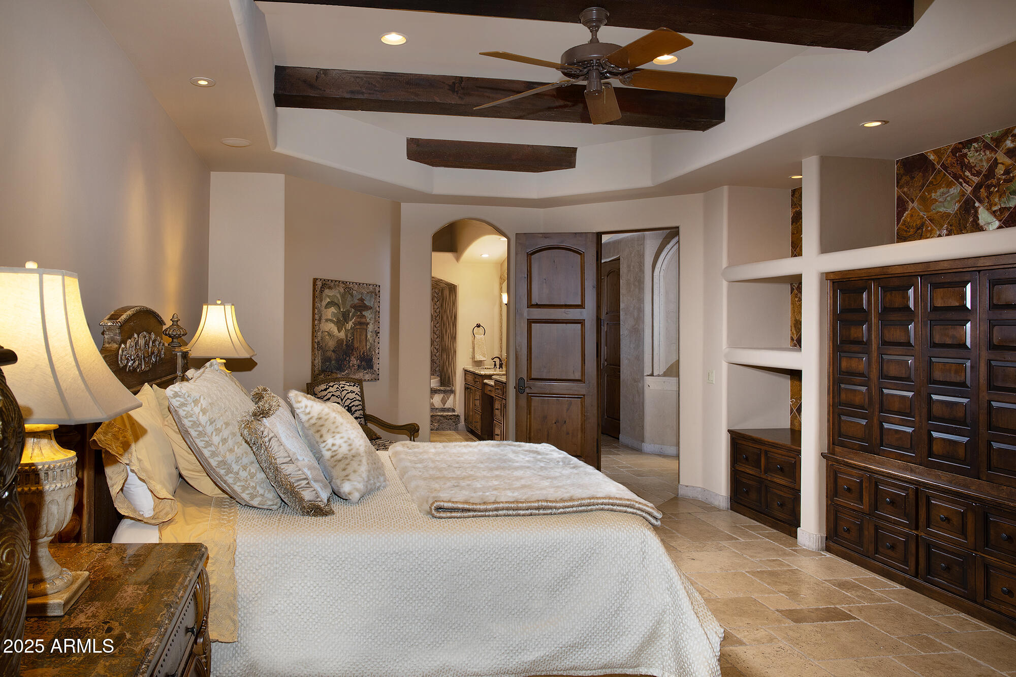 10801 East Happy Valley Road, Unit 119 Scottsdale, AZ 85255 - Photo 42 of 52 a spacious bedroom with a bed a dresser and a large mirror