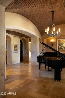 a view of living room with furniture and a fireplace