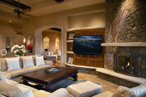 a living room with furniture and a fireplace