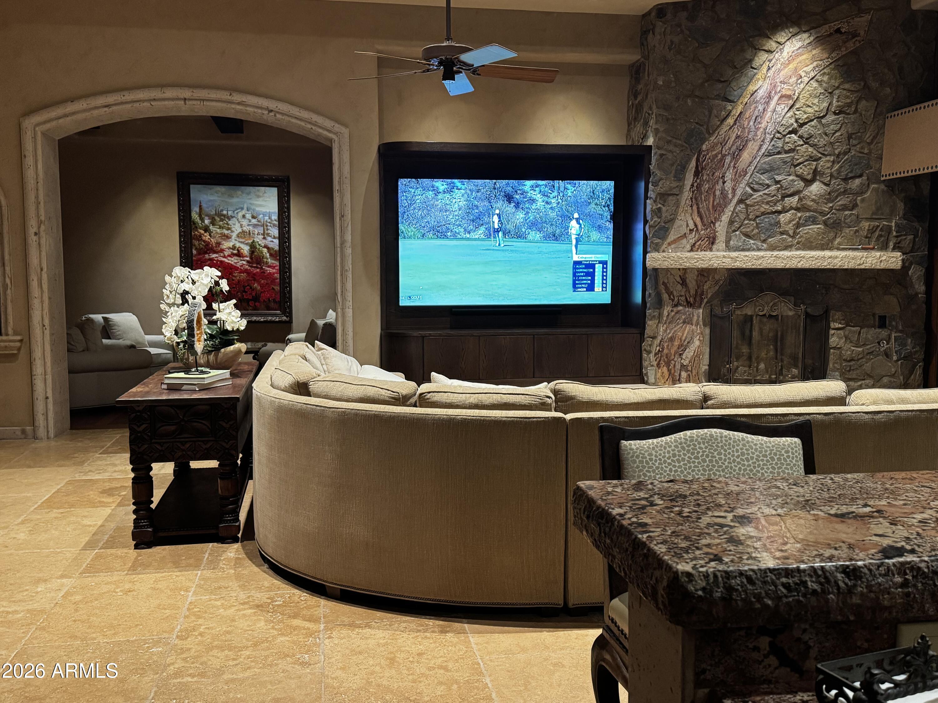 10801 East Happy Valley Road, Unit 119 Scottsdale, AZ 85255 - Photo 7 of 52 a living room with furniture and a flat screen tv