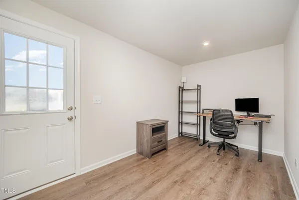 a bathroom with a sink mirror and a window