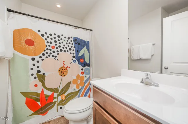 a view of a workspace with furniture and a flat screen tv