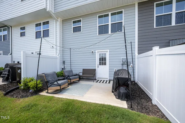 a view of a two chairs in the patio