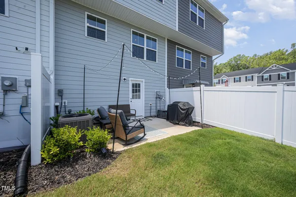 a backyard of a house with seating space