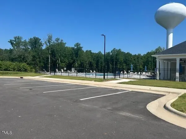 a view of a swimming pool and a yard