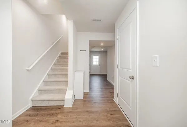 a front view of a house with a yard and a garage