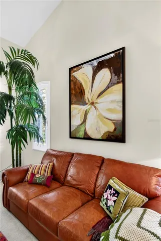a view of a dining room with furniture and window