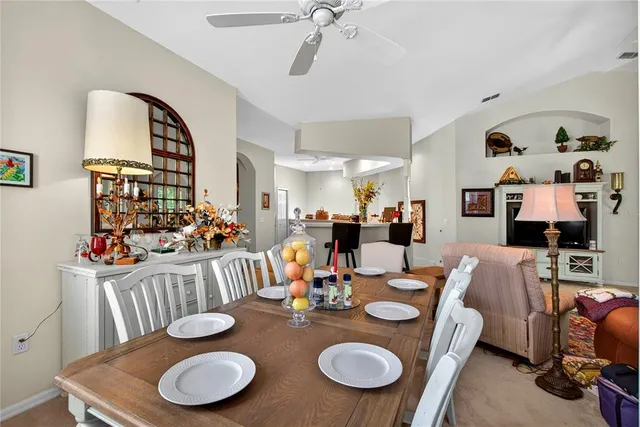 a view of kitchen with a table and chairs