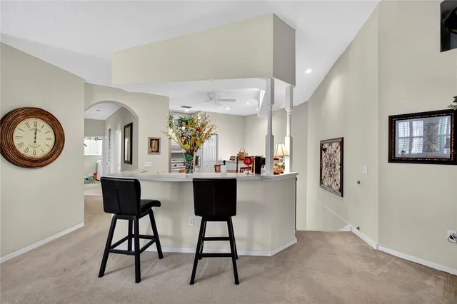 a kitchen that has a table and chairs in it