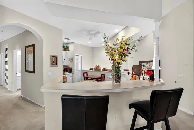 a dining room with a table and chairs