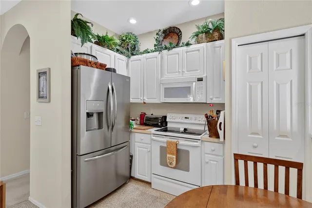 a view of a livingroom with furniture and workspace