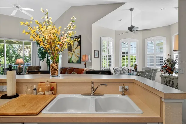 a view of a bedroom with a bed and lamp