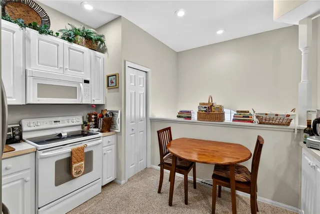 a bathroom with a bathtub a sink and a window