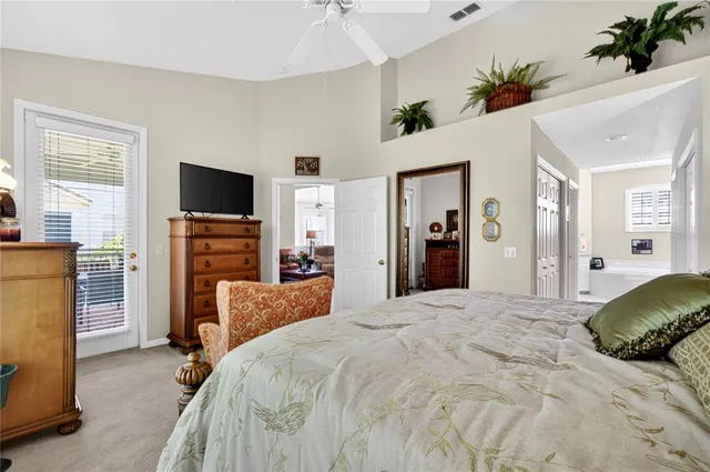 a view of a livingroom with workspace and a window