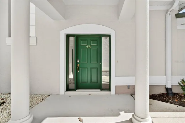 a bathroom with a walk in closet and a mirror