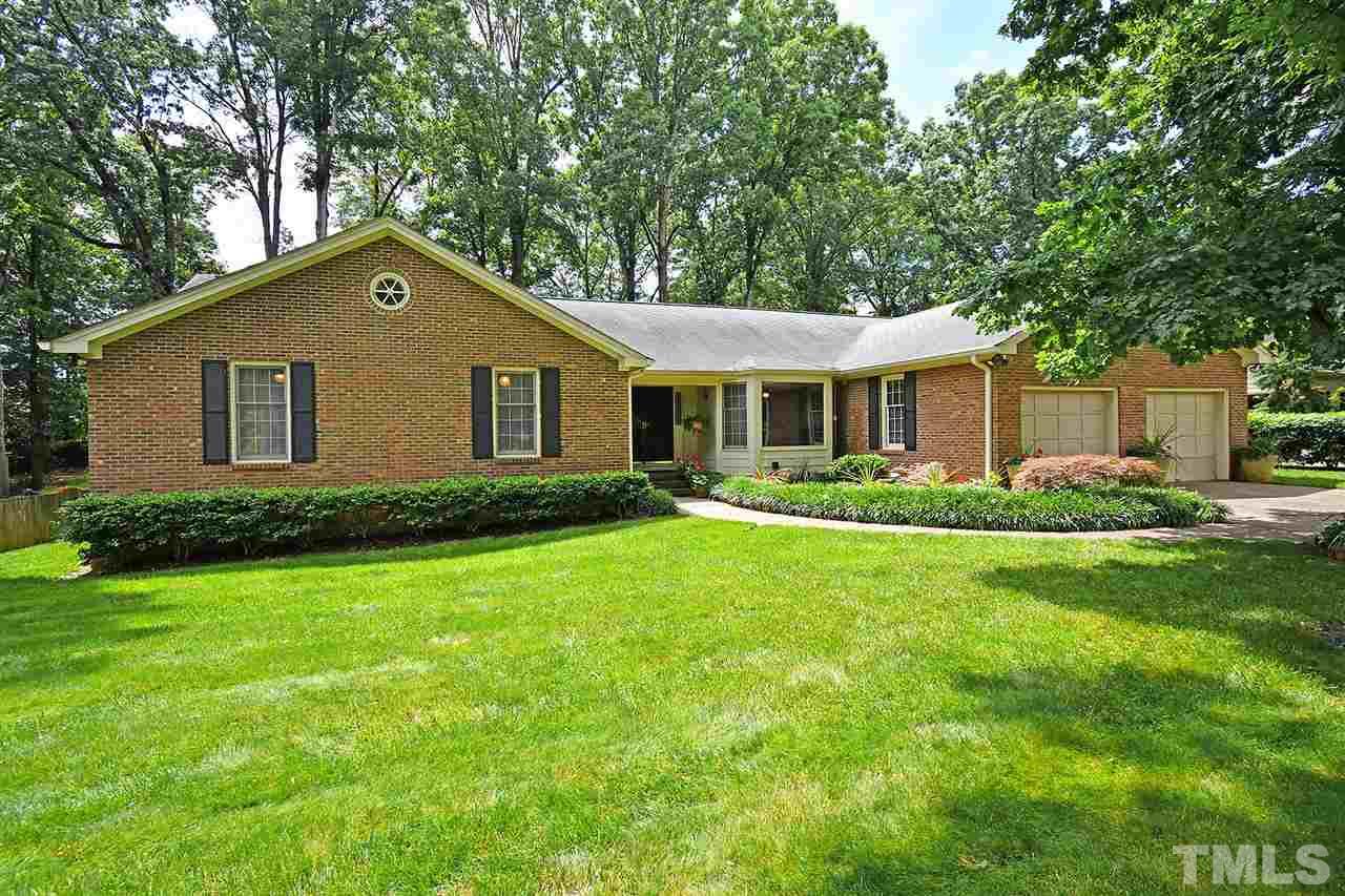 9437 Springdale Drive Raleigh, NC 27613 - Photo 2 of 30 a front view of house with yard and green space