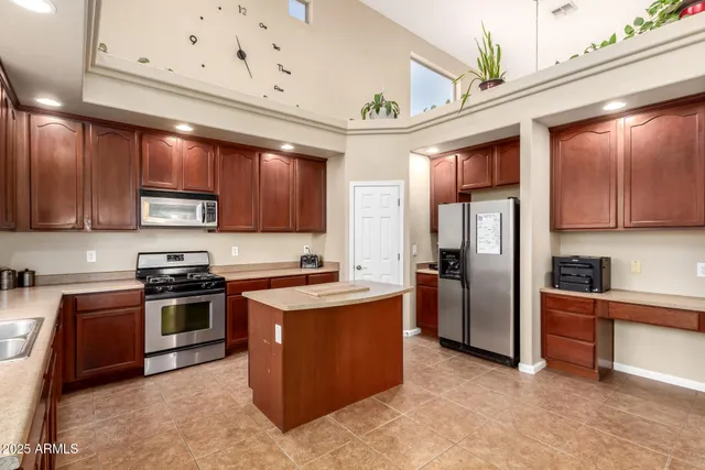 a bedroom with furniture and a flat screen tv