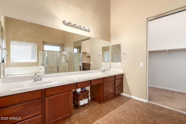 a large bathroom with a large tub and sink