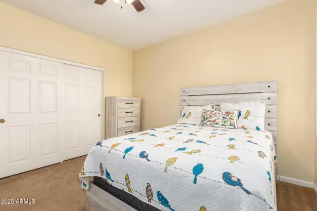 a bedroom with a bed and a dresser