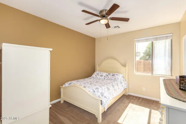a bedroom with furniture and a window