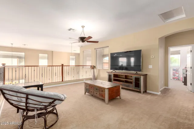 a view of a living room and a floor to ceiling window
