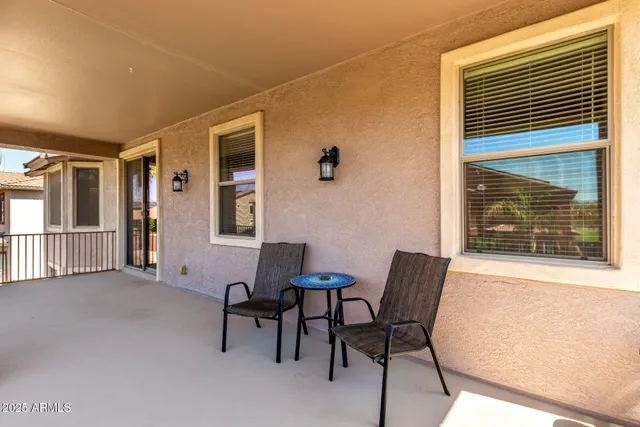 a view of a house with swimming pool and a yard