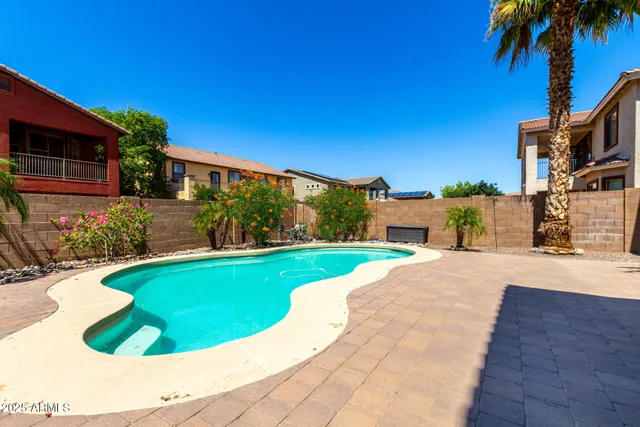 a view of a house with backyard porch and sitting area