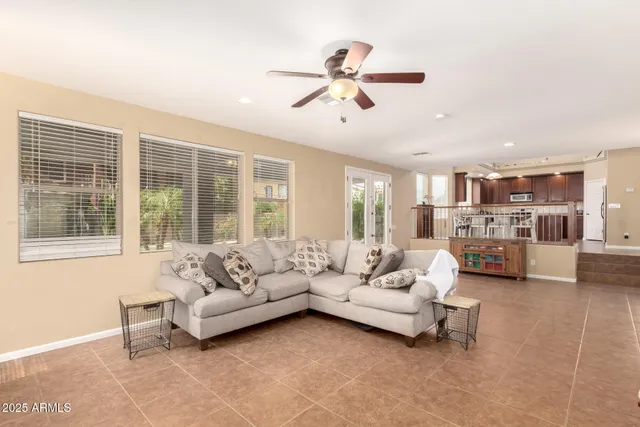 a living room with furniture gym equipment and a view of bedroom
