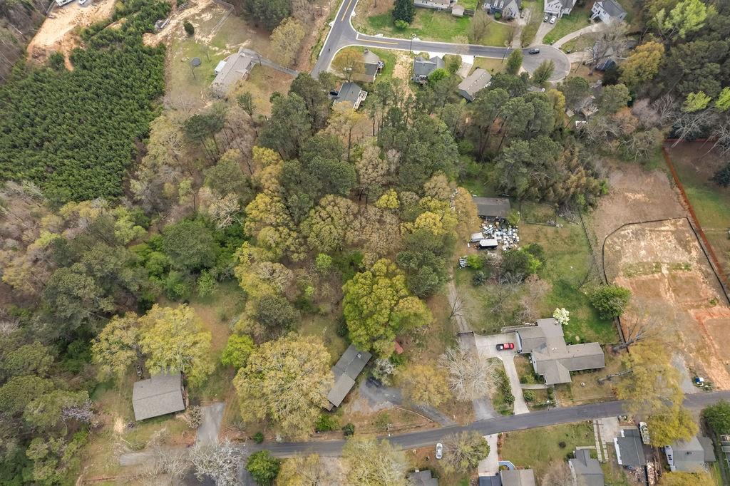 a backyard of a building with large trees