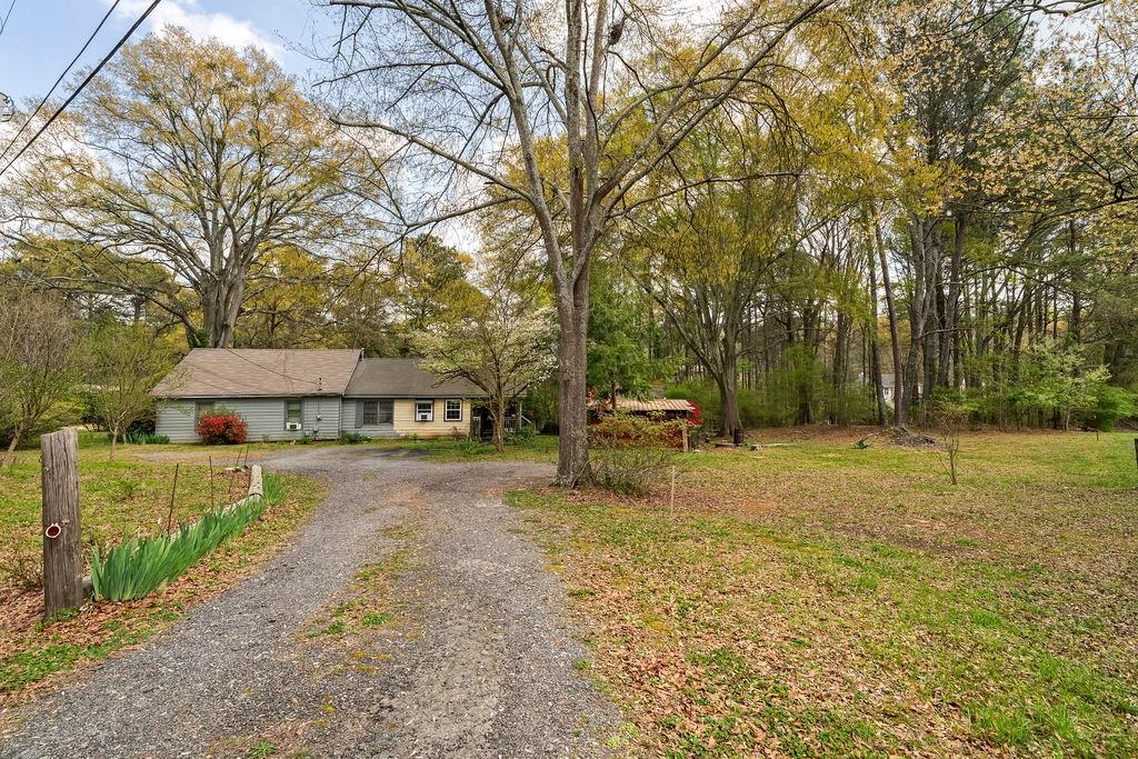 4661 Fowler Street Acworth, GA 30101 - Photo 14 of 23 a house with trees in front of it