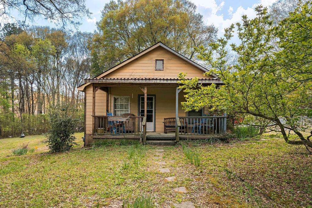 4661 Fowler Street Acworth, GA 30101 - Photo 3 of 23 a view of house that has a small yard