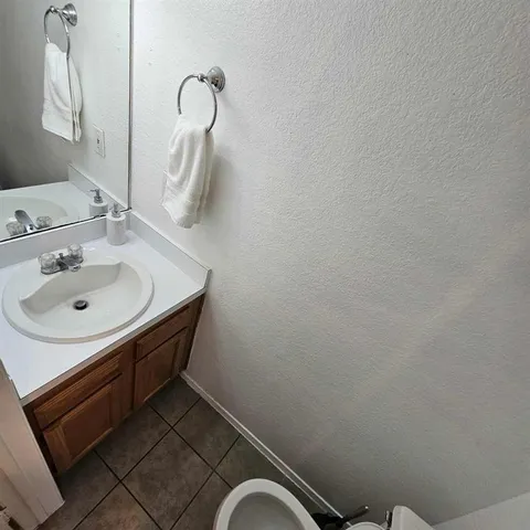 a bathroom with a sink and mirror