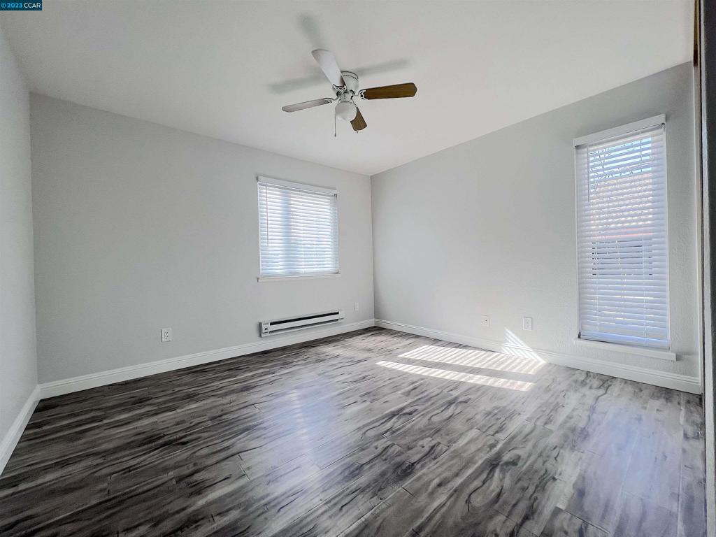 1505 Kirker Pass Road Concord, CA 94521 - Photo 12 of 22 wooden floor in an empty room with a window