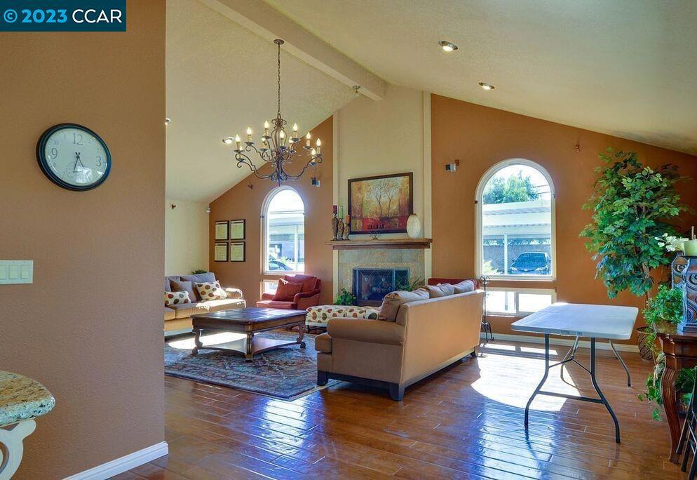 1505 Kirker Pass Road Concord, CA 94521 - Photo 20 of 22 a living room with furniture a fireplace and wooden floor