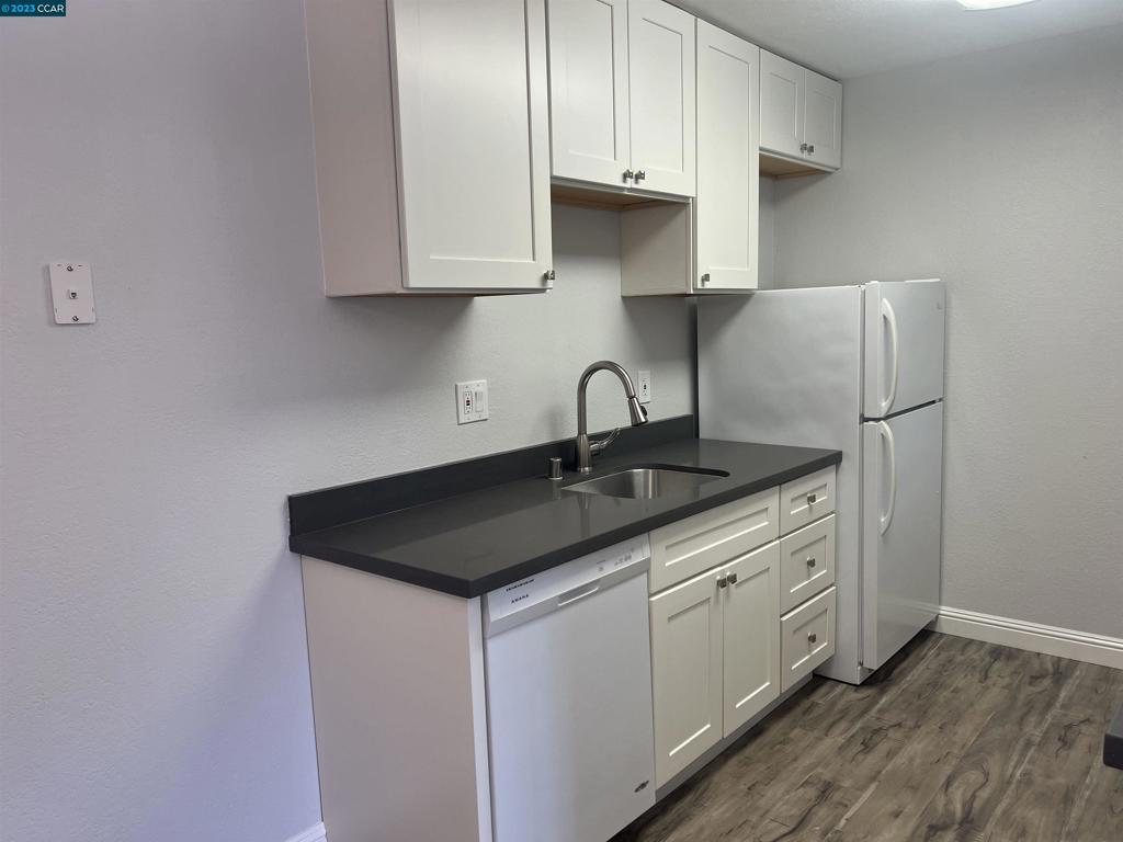 1505 Kirker Pass Road Concord, CA 94521 - Photo 7 of 22 a kitchen with stainless steel appliances granite countertop a sink stove and cabinets