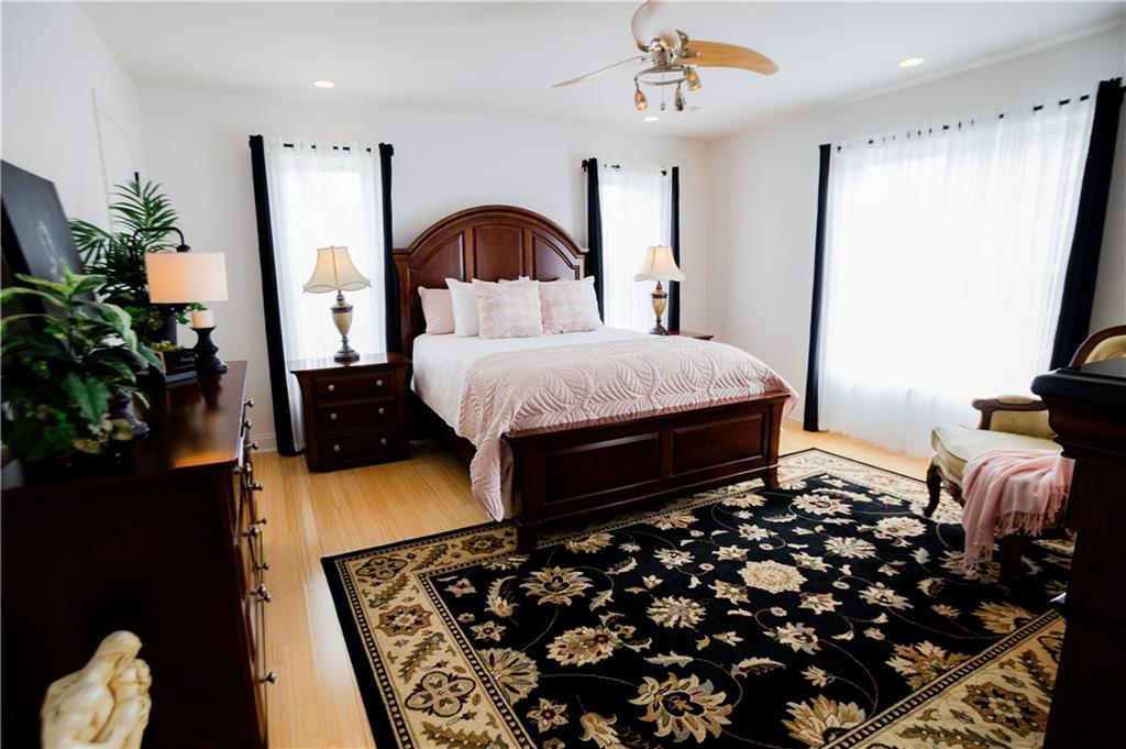110 Mae Lane Uniontown, PA 15401 - Photo 29 of 41 a bedroom with bed and a potted plant