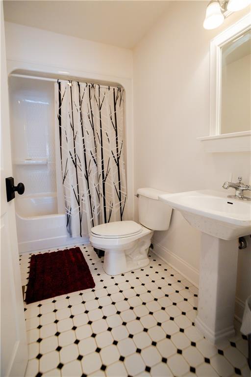 110 Mae Lane Uniontown, PA 15401 - Photo 36 of 41 a bathroom with a sink a toilet a mirror and shower