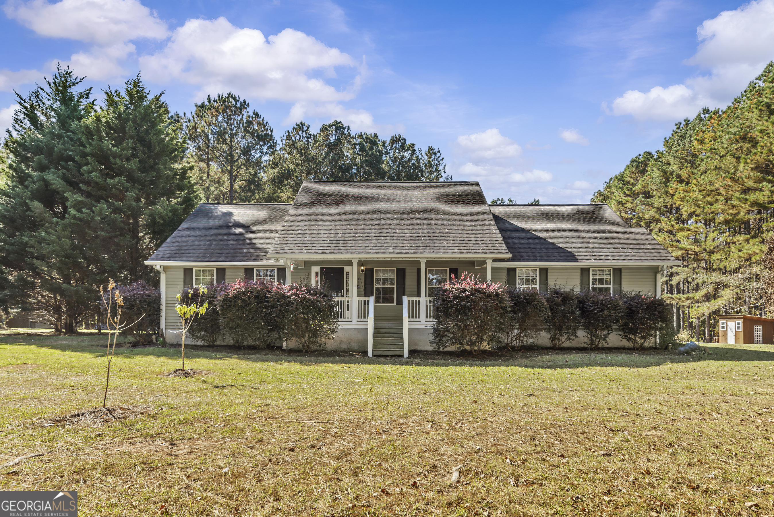 384 Scuffleboro Road Southeast Eatonton, GA 31024 - Photo 1 of 48 a front view of a house with a yard