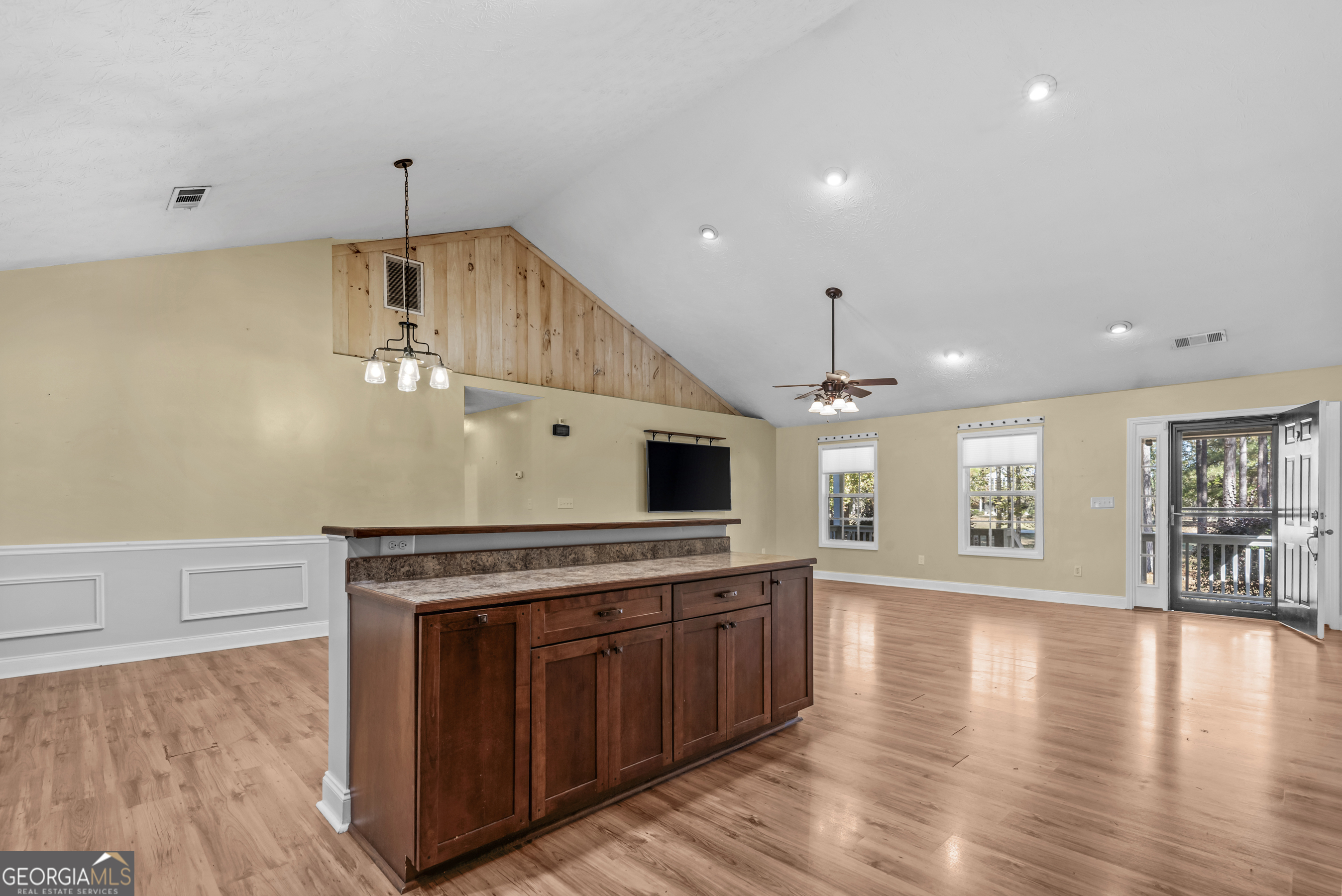 384 Scuffleboro Road Southeast Eatonton, GA 31024 - Photo 14 of 48 a kitchen with stainless steel appliances a stove top oven a sink and a refrigerator