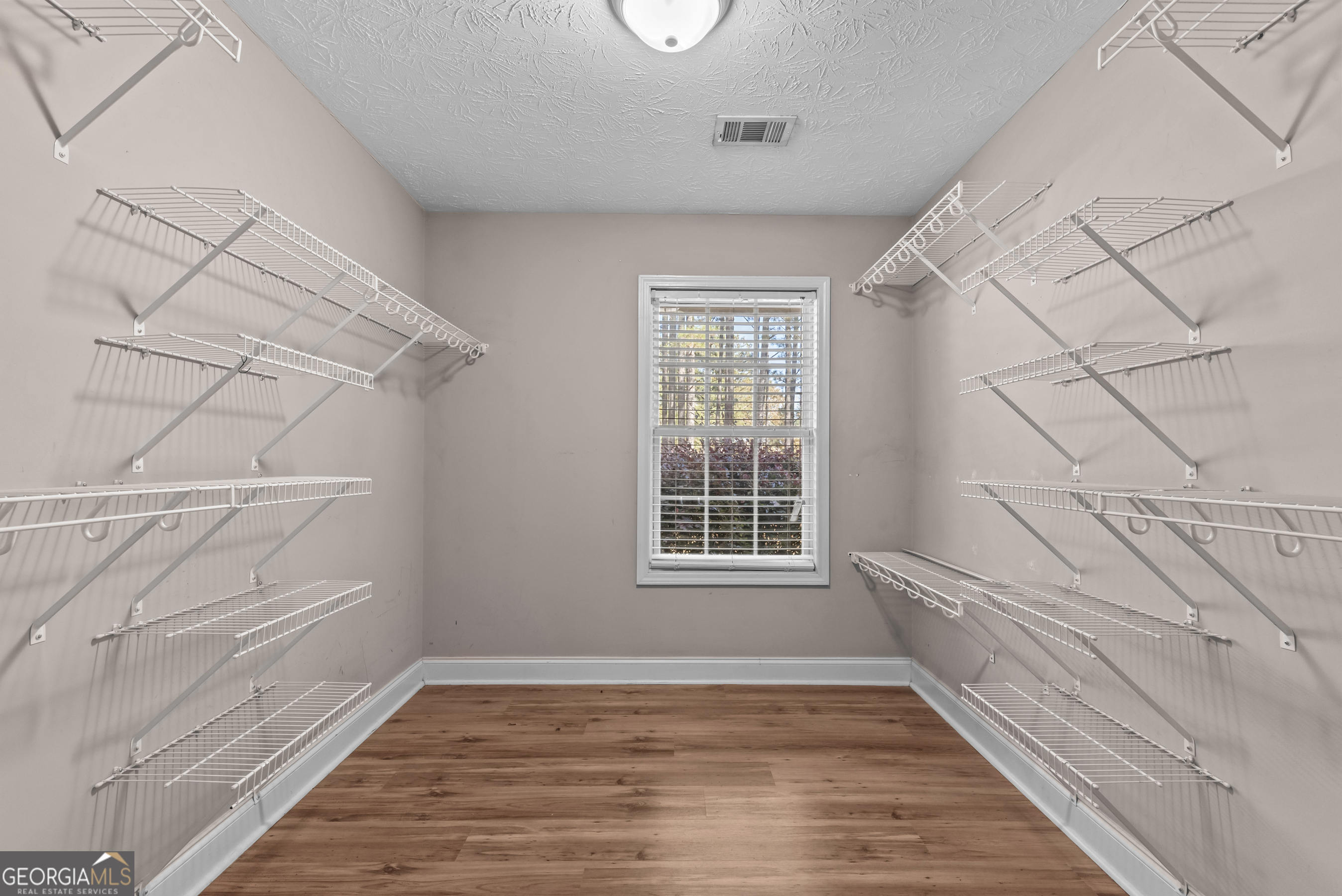 384 Scuffleboro Road Southeast Eatonton, GA 31024 - Photo 19 of 48 a view of an empty room with a window