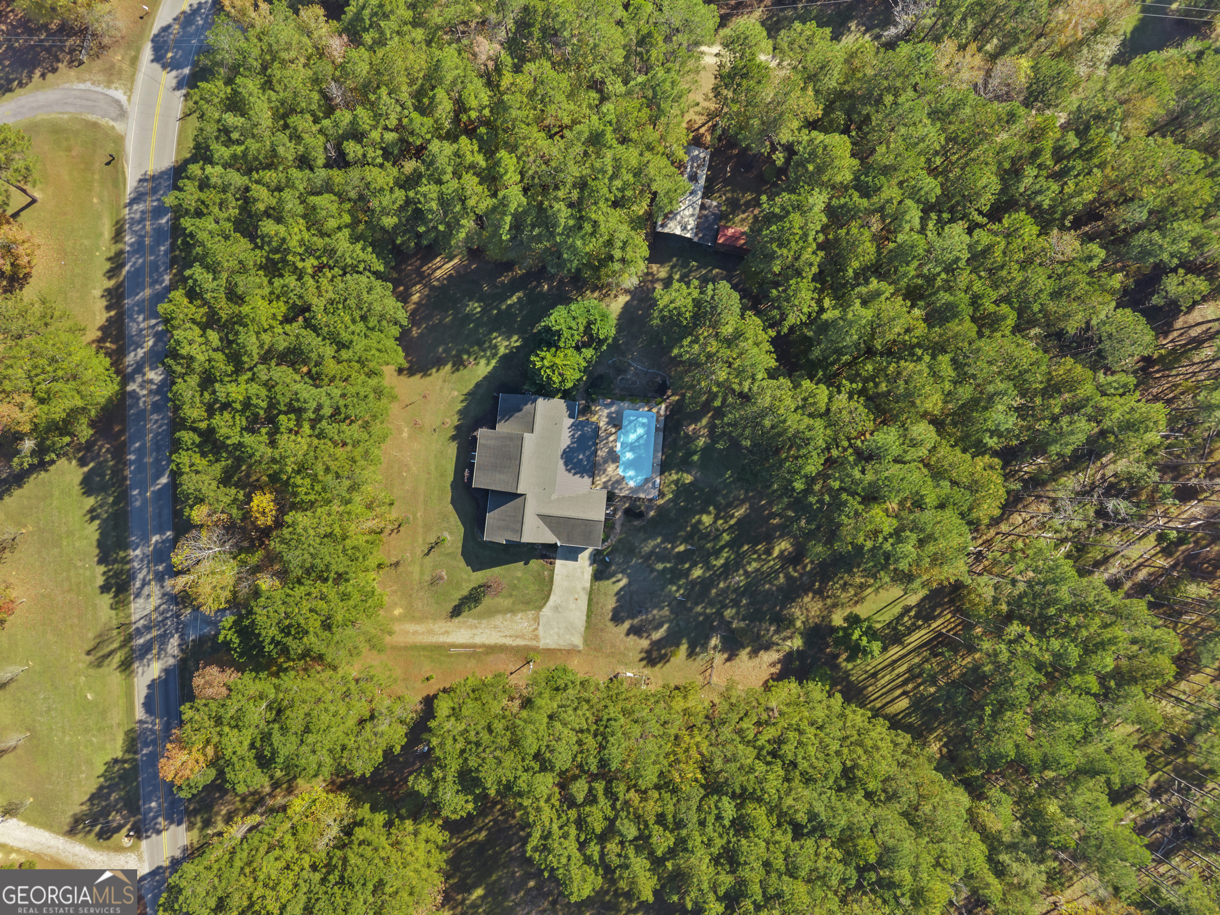 384 Scuffleboro Road Southeast Eatonton, GA 31024 - Photo 3 of 48 a view of a house with a tree park